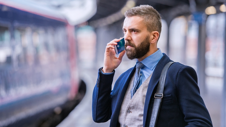 business man making a call on his smartphone