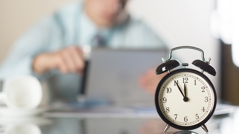 businessman with alarm clock