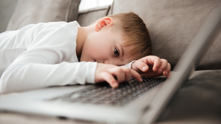 sad boy with computer