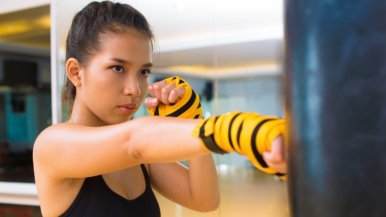 girl practicing kickboxing