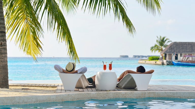 couple relaxing on resort island