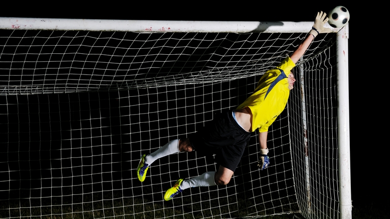 goalie catching a ball