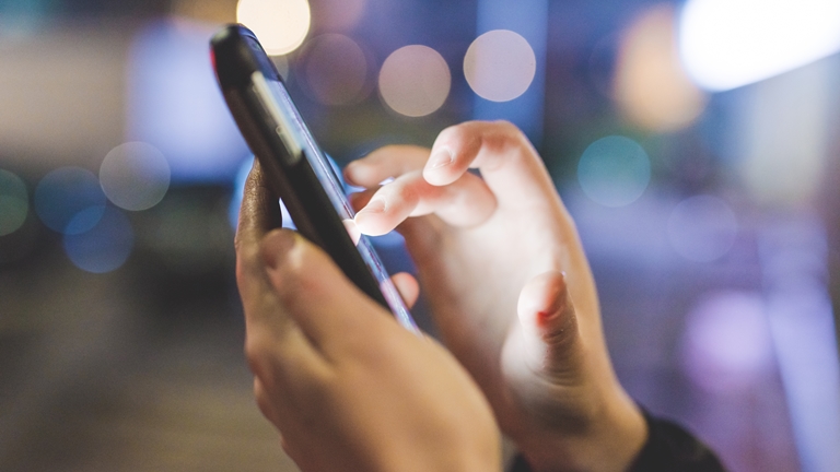 a man holding a phone