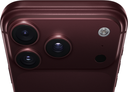 iPhone 18 Pro Max, burgundy colour (dark red), back exterior, Pro Fusion camera system at top, three lenses, variable aperture blades partially closed, flash, microphone and LiDAR Scanner, top exterior, mobile antenna, flat sides, rounded edges